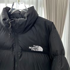 Embrace timeless style and unbeatable warmth with this black puffer jacket, inspired by the iconic The North Face 1996 Retro Nuptse. The classic boxy silhouette and oversized baffles offer a retro-inspired look, while the high-quality down-filling ensures exceptional insulation against the cold. The sleek black colorway adds a touch of urban sophistication, making this jacket perfect for city streets and outdoor adventures. Order your normal size, and we'll reach out to you via email or WhatsApp The North Face 1996 Retro Nuptse, The North Face 1996, North Face 1996, Urban Sophistication, Black Puffer Jacket, Loafer Sneakers, Black Puffer, Bottega Veneta Shoulder Bag, Black North Face