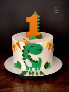 a birthday cake with a dinosaur on it