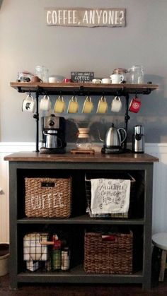 a coffee bar with baskets on the bottom shelf