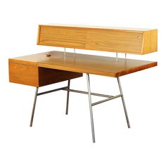 a wooden desk with metal legs and drawers