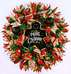 a christmas wreath decorated with gingerbreads and decorations