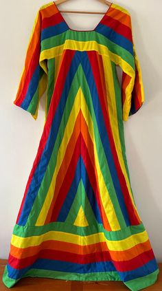 Vintage 1970's Suttles and Seawinds Rainbow Chevron Pieced Patchwork Lined Kaftan Dress Folkwear Made in Nova Scotia Size Medium What an amazing rainbow dress! The sewing on this is impeccable. Multicolor striped pieced patchwork rainbow caftan 1970's Raglan sleeve Court neckline Lined Center back zip closure Excellent vintage condition Women's size medium. Chest: 36 Length: 57 Sleeve: 16 by Designer Vicki Lynn Bardon, Suttles & Seawinds Handmade in Nova Scotia, Canada. Please see photos for accurate description of item. All vintage items are final sale. Please visit my other vintage collectibles in my shop : https://www.etsy.com/ca/shop/Sewfunky?ref=shop_sugg§ion_id=31004548 1970s Style Multicolor Maxi Dress, Multicolor Tunic Kurta For Spring, Multicolor Cotton Vintage Dress, Retro Cotton Dresses For Festival, Retro Cotton Festival Dress, Multicolor Vintage Kaftan For Festivals, Vintage Multicolor Long Kaftan, Multicolor Tunic Kurta For Festival, 1970s Multicolor Summer Dresses