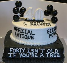 an image of a birthday cake with balloons on the top that says forty isn't old if you're at tree