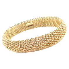 18k Yellow Gold Somerset Wide Mesh Bangle Bracelet by TIffany & Co. Details: Length: 7.5" Weight: 91.9 grams Width: 15mm Stamped Hallmarks: Tiffany&Co. 750 *Free Shipping within the United States* YOUR PRICE: $10,000 T3325lmed Gold Tiffany Bracelet, Tiffany Bangles Gold, Gold Bangle Bracelet For Women Tiffany & Co., Elegant Bracelet Tiffany & Co., Cuff Bracelets Gold Tiffany & Co., Tiffany And Co Bracelet, Tiffany Bracelets, Braids With Weave, Gold Armband