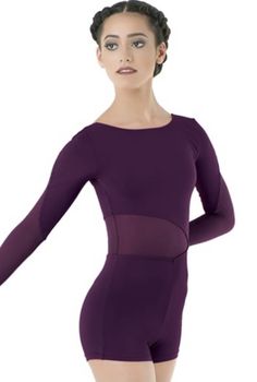 a woman in a purple leotard with her arms out and hands behind her back