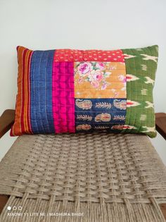 a cushion made out of different colored fabrics