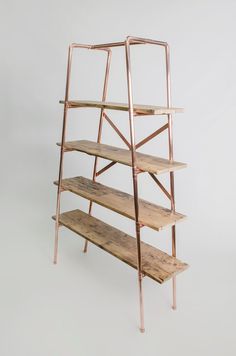 a metal and wood shelf with three shelves on each side, against a white background