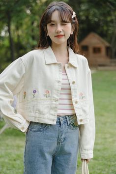 Cropped denim jacket in a creamy white color with embroidered flowers along the front. S: 16.5" across shoulders, 40" chest, 19" lengthM: 17" across shoulders, 41.5" chest, 19" lengthL: 17.5" across shoulders, 43" chest, 19" length White Jean Jacket Outfits, Personal Garden, Jean Jacket Outfits, Denim Jacket Outfit, White Jean Jacket, Embroidered Denim Jacket, Cropped Denim Jacket, Embroidered Denim, Overall Dress