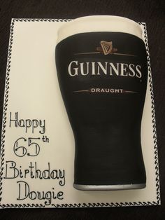 a birthday cake with a guinness glass on it