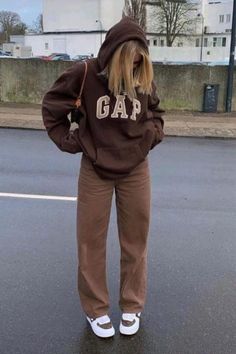 TikTok star Barbara Kristoffersen raised the stakes when she uploaded a video of herself wearing the Gap hoodie in a brown colorway that the brand hasn’t made since the early aughts—and racked up close to two million views in the process.shop the brown gap hoodie now. gap brown hoodie, gap vintage brown sweater Brown Hoodie Outfit, Hoodie Gap, Gap Outfits, Brown Hoodie, Brown Jeans, Aesthetic Outfit Ideas, Brown Outfit, Sweatshirt Outfit, Hoodie Outfit