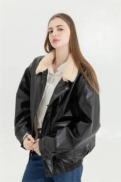 This versatile faux leather jacket features a soft-touch lining and faux fur for extra warmth. Its classic collar and drop shoulder design offer a modern twist, while the zip and button fastening ensure practicality. Complete with two front pockets, it's perfect for a grunge, casual, or streetwear look in cooler weather. Faux fur interior for enhanced comfort Classic collar Drop shoulder Zip & button fastening Two pockets at front Button fastening on pockets Buttons at cuffs Winter Biker Jacket With Zipper And Collar, Trendy Leather Jacket With Faux Fur Lining For Work, Winter Collared Biker Jacket With Zipper Closure, Collared Biker Jacket With Zipper For Winter, Collared Faux Leather Winter Outerwear, Trendy Faux Leather Outerwear With Faux Fur Lining, Trendy Faux Leather Outerwear With Faux Fur Trim, Trendy Leather Jacket With Padded Collar For Winter, Trendy Winter Leather Jacket With Padded Collar