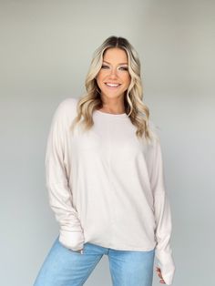 Stay warm and cozy in style with this luxurious Dolman Sleeve Top. Ultra soft and fuzzy fabric stretches to fit, allowing for ease of movement. The relaxed fit and rounded neckline make it perfect for layering and to elevate any basic outfit. Perfect for all occasions from a coffee run to a movie night by the fireplace. Experience comfort and exclusivity today. Self 95% Rayon 5% Spandex Machine wash cold. Beige Long Sleeve Cozy Fit Top, Beige Long Sleeve Tops With Cozy Fit, Cozy Soft-washed Solid Color Sweater, Oversized Super Soft Comfy Sweater, Super Soft Oversized Comfy Sweater, Oversized Soft Knit Chic Top, Comfy Oversized Super Soft Sweater, Oversized Comfy Super Soft Sweater, Chic Oversized Soft Knit Top