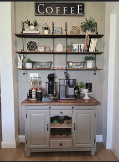 a coffee bar in the corner of a room with shelves above it and various items on top