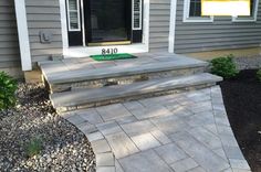 a front porch with steps leading up to the door