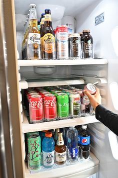 a refrigerator filled with lots of different types of drinks