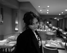 black and white photograph of a woman in a restaurant