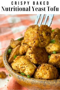 a bowl filled with crispy baked nutritional yeast tofu