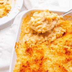 a casserole dish with mashed potatoes and gravy in it, ready to be eaten