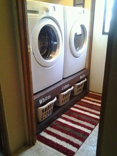 a washer and dryer in a bathroom next to each other