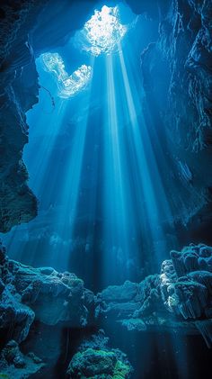 an underwater cave with sunlight streaming through the water