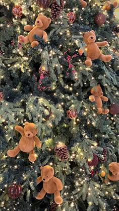 a christmas tree with teddy bears and pine cones