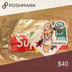 some stickers that are on the side of a plastic bag and in front of a wooden table