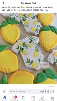 decorated cookies in the shape of lemons with green leaves