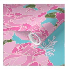 a pink and blue floral wallpaper with white flowers on the bottom half of it