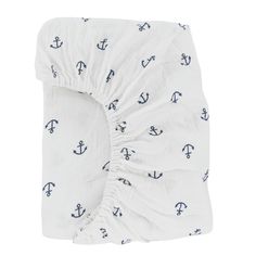 a white sheet with an anchor print on it and blue anchors printed on the bottom