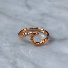 24K Gold plated Wave Ring with a hammered textured finish. Embrace the summer vibe with this ocean inspired wave ring. A perfect gift for beach lovers and surfers. Available in 925 Sterling Silver https://etsy.me/2MtmxmI Available in Brass https://etsy.me/2FUss2O Ring Size Available in all sizes. Please be sure to find your exact ring size for the finger you want before ordering. See image chart above or you can use the chart on my website as a guide - https://jewelrylab.co/pages/ring-sizing-tip Gold Ocean-inspired Rings For Beach, Wavy Gold Rings For Gift, Gold Wavy Rings For Gifts, Pinky Rings For Women, Mens Pinky Ring, Gold Pinky Ring, Hawaiian Jewelry, Womens Ring, Hammered Ring