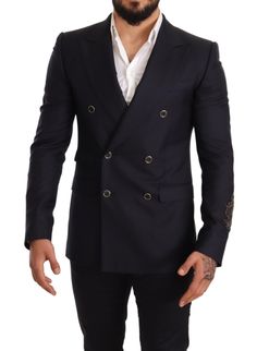 Refine your wardrobe with this impeccably crafted blazer from the luxurious Dolce & Gabbana. Designed for the discerning gentleman, this formal navy blazer exudes sophistication with its peak lapel style and slim fit tailoring. Made from a sumptuous blend of 90% cashmere and 10% silk, it is both comfortable and elegant, perfect for exclusive events and professional settings alike. The distinctive double-breasted two-button design and intricate logo embroidery signal a garment of high craftsmansh Dolce And Gabbana Suits, Formal Blazer, Dolce And Gabbana Blue, Navy Blue Blazer, Peak Lapel, Sports Blazer, Navy Blazer, Dolce And Gabbana Man, Double Breasted Blazer