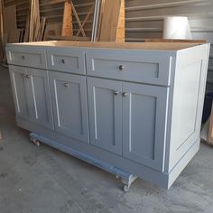 an unfinished kitchen island being built in a garage