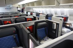 the inside of an airplane with empty seats