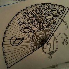 a drawing of a fan with flowers on it