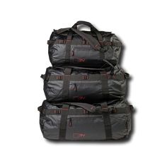 three duffel bags stacked on top of each other in front of a white background