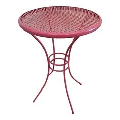 a small pink table with metal legs and a round design on the top, against a white background