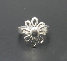 Sterling silver ring 925/1000, flower. Stamped 925.Approximate weight 2.7 grams. Front dimensions 1.7x1.5 cm (0.68x0.60 inches). All our jewels are made from solid sterling silver 925/1000 and are carefully crafted by hand in our family workshop. We dispatch your orders in 5 working days, worldwide and the postage is $5. We ship registered priority mail. Please allow 5-7 working days for delivery in Europe and 10-15 working days outside Europe. For any questions - please do not hesitate to conta Hallmarked Silver Flower Ring, Formal Flower Ring Stamped 925, Formal Flower Shaped Rings Stamped 925, Sterling Silver Flower Ring For Formal Occasions, Formal Sterling Silver Flower Ring, Formal Flower Shaped 925 Silver Ring, Silver Flower Shaped Ring Stamped 925, Silver Flower Ring Stamped 925, Silver Flower Shaped Hallmarked Rings