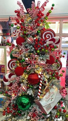 a christmas tree decorated with candy canes and ornaments