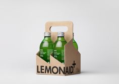 two bottles of lemonade in a cardboard box