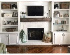 a living room filled with furniture and a flat screen tv mounted above a fire place