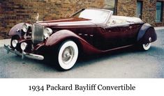 an old car parked in front of a brick building with the caption 1932 packard bayfl convertible