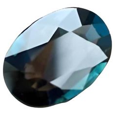 an oval shaped blue diamond on a white background