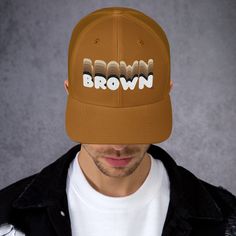 Brown culture appreciation themed simple but stylish hat with a simple but powerful message with a retro feel celebrating self love and brown pride and the different shades of brown people featuring the word Brown embroidered on a trucker style baseball cap available in assorted colors with an adjustable back this trucker hat is a great addition to your closet and makes a great gift Culture Appreciation, Brown People, Different Shades Of Brown, Brown Love, Brown Pride, Love Hat, Caramel Brown, Stylish Hats, Shades Of Brown