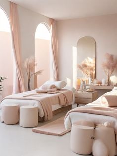 a bedroom with pink walls and flooring is pictured in this image, there are two beds that have pillows on them