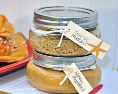 jars filled with food sitting on top of a table