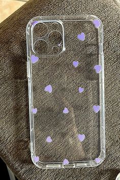 a clear case with purple hearts on it