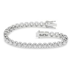 Sure to be loved, this blissful lab-created diamond tennis bracelet simply dazzles. 14K white gold Round certified lab-created diamonds in buttercup settings create each link F color/SI2 clarity Includes certification card 7 cts. t.w. of lab-created diamonds 7.25 inches; box clasp Diamond Tennis Bracelet, Box Clasp, To Be Loved, Tennis Bracelet Diamond, Lab Created Diamonds, Tennis Bracelet, Diamond Bracelet, Tennis, Lab