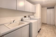 a washer and dryer in a small room