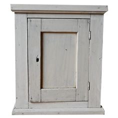 an old white wooden cabinet with one door and two drawers on the front, isolated against a white background