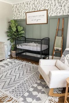 a baby crib in the corner of a room with a rug on the floor